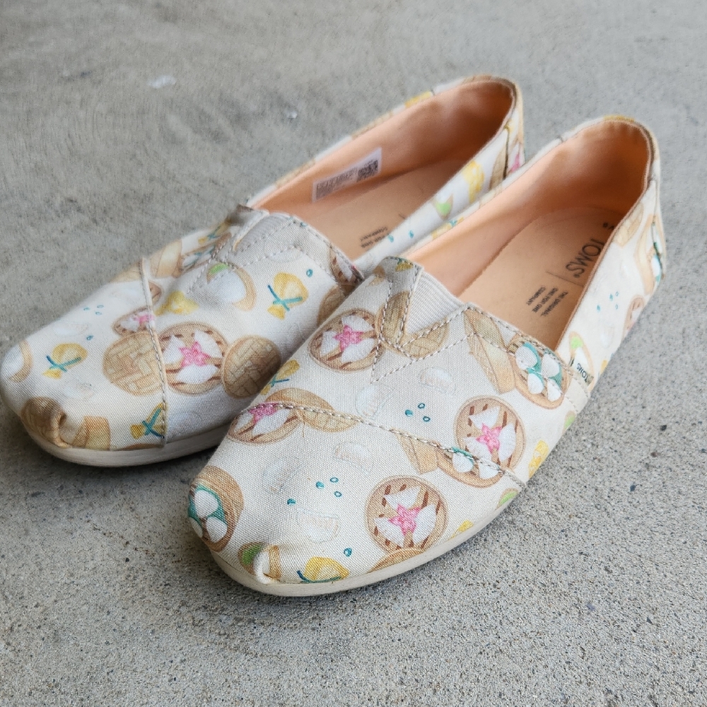TOMS Women's Tan Moccasins with Dim Sum Print